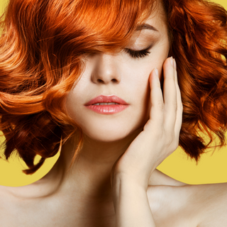 red haired woman with full voluminous soft wave bob